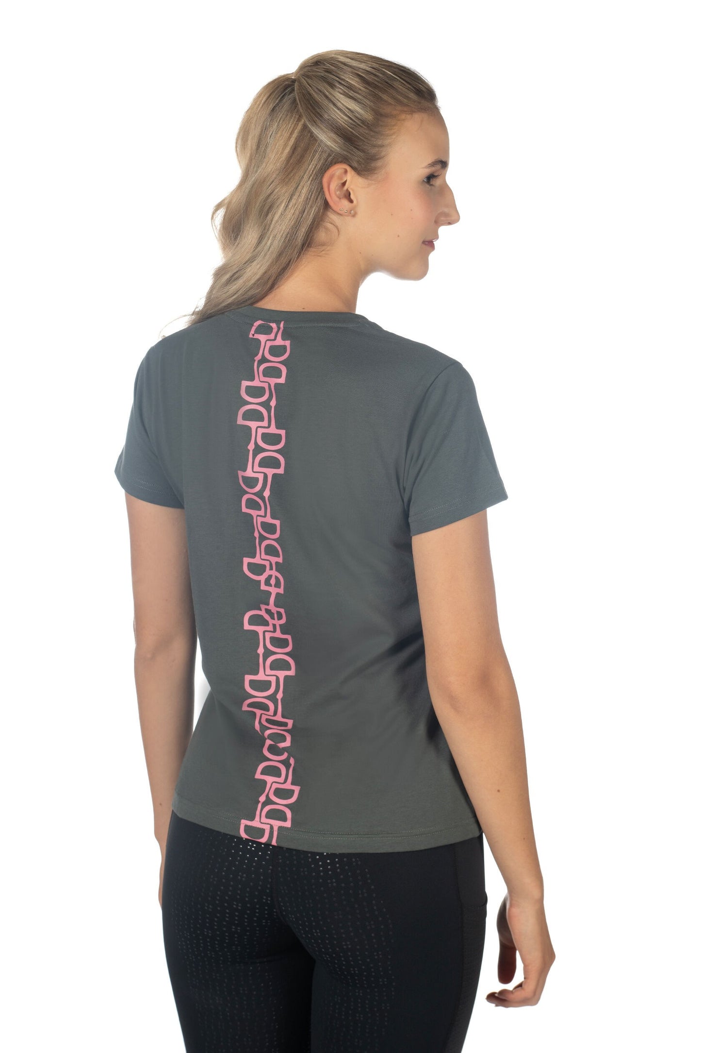 Model showing the back of a grey/green tee shirtwith a single vertical design of pink Dee ring snaffle bits from top to bottom of shirt