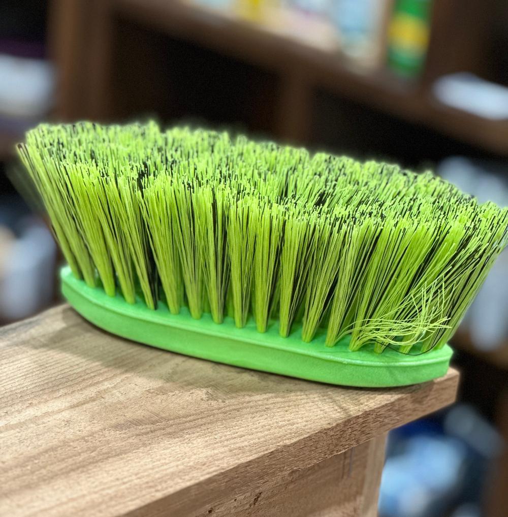 Bright lime gee hand held grooming brush with relatively long bristles