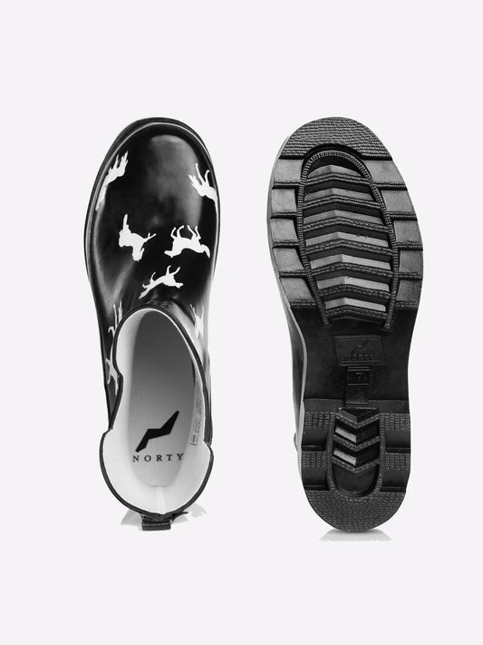 Top and bottom view of black rubber boots with white horse pattern