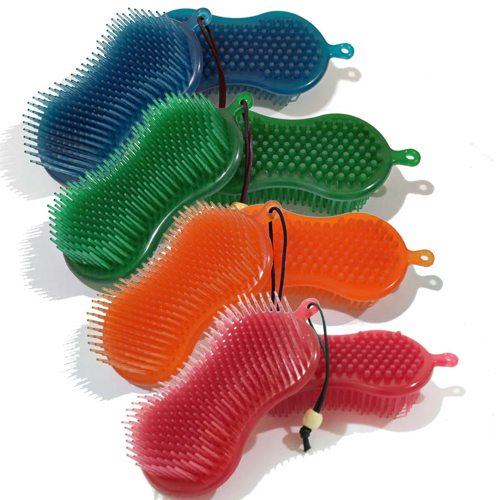 two sided equine jelly brush shown in four colors