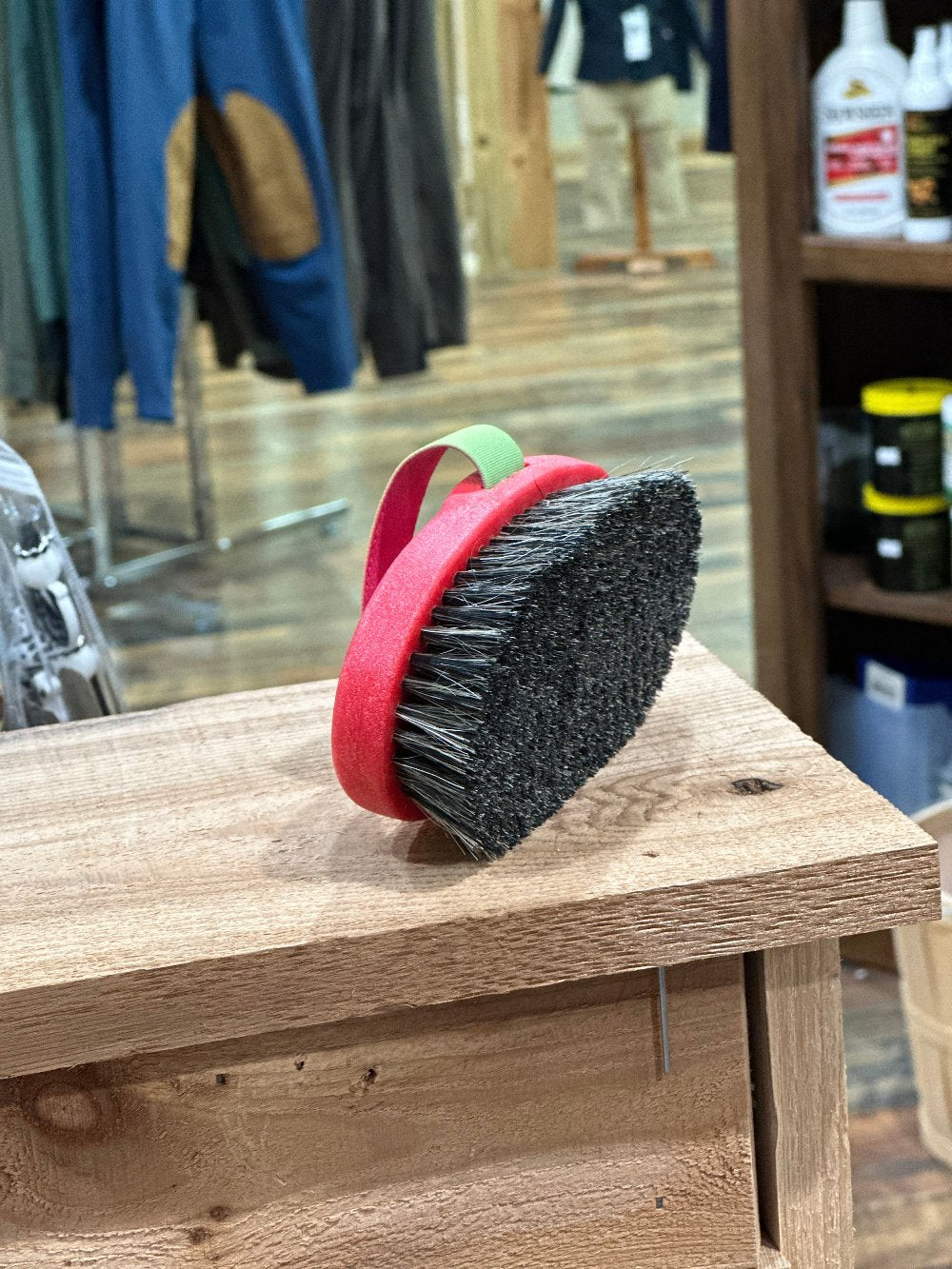 hand held grooming brush with medium/short length bristles - red