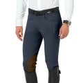 Men's dark blue grey riding breeches with darker knee patch. Model is wearing a dark belt and tall equestrian riding boots