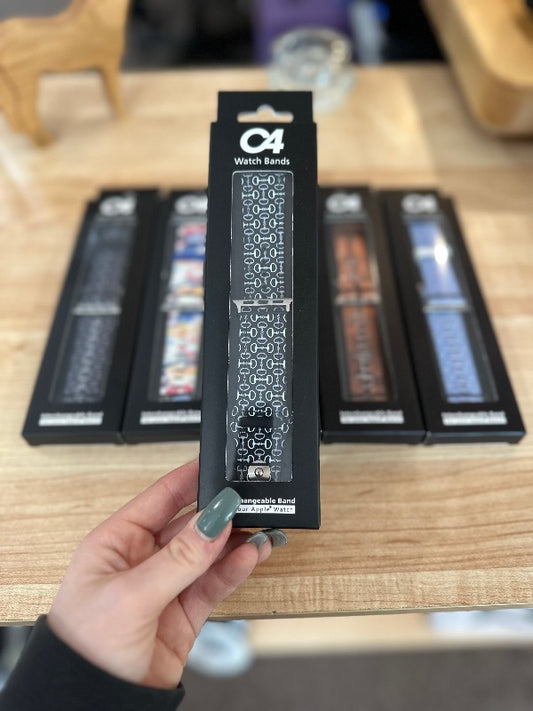 Brand C4 watch band for Apple Watch. Black band with white horseshoe print.