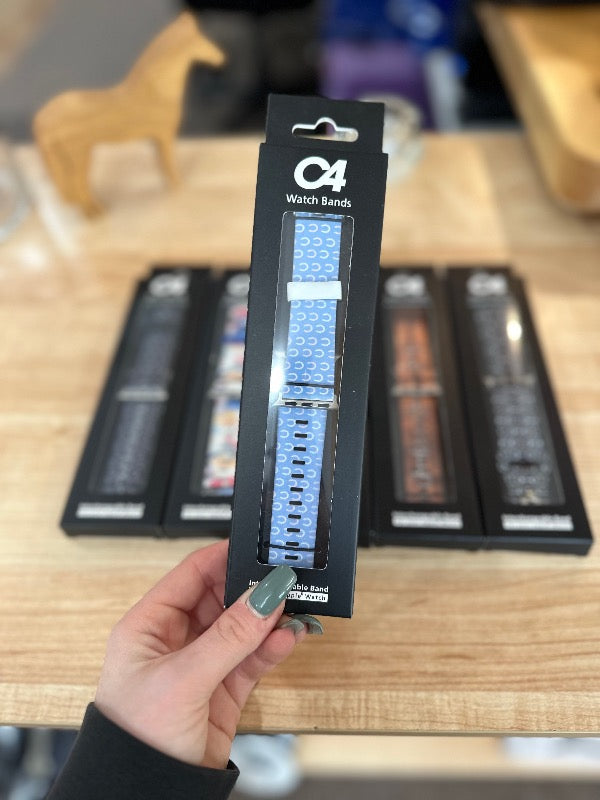 Brand C4 watch band for Apple Watch. Pastel blue with white horseshoe print.