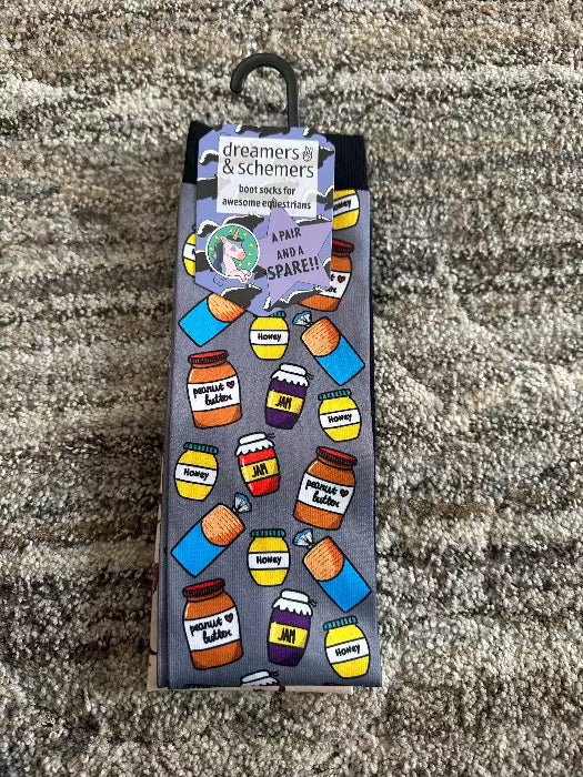 pair of socks grey background with jam and peanut butter containers