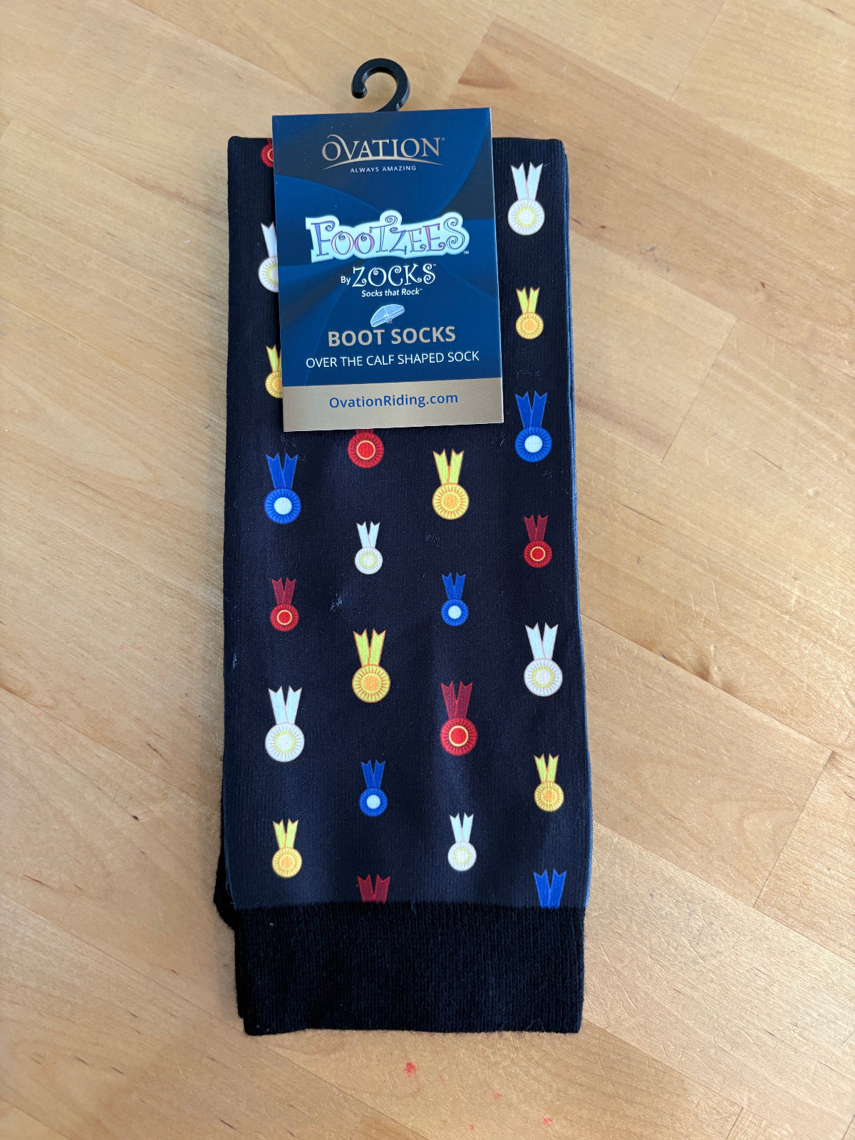 Black socks with colorful horse show ribbons all over