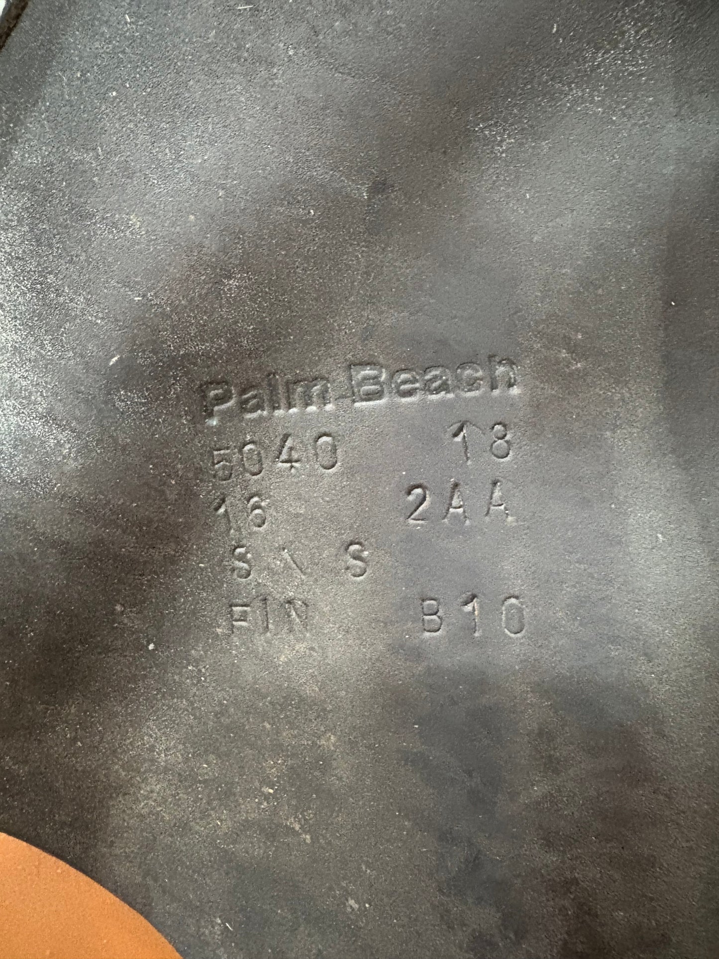 Manufacture stamp on the leather of a saddle. Palm Beach 5040 18 16 2AA S/S FIN B10