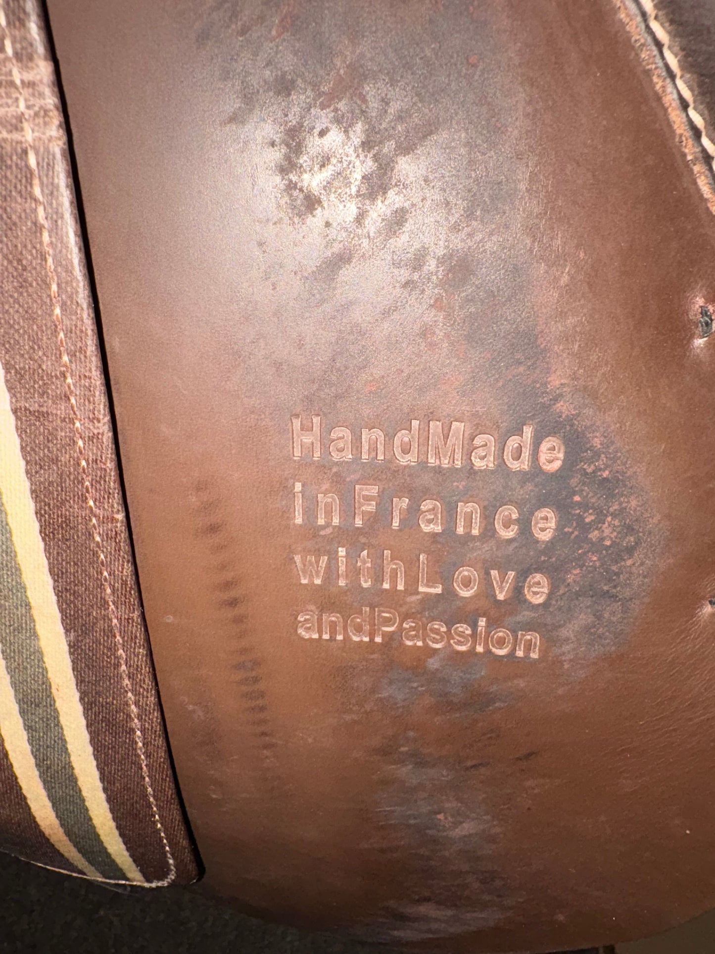 Inside saddle flap stamp. Showing: Hand Made in France with Love and Passion