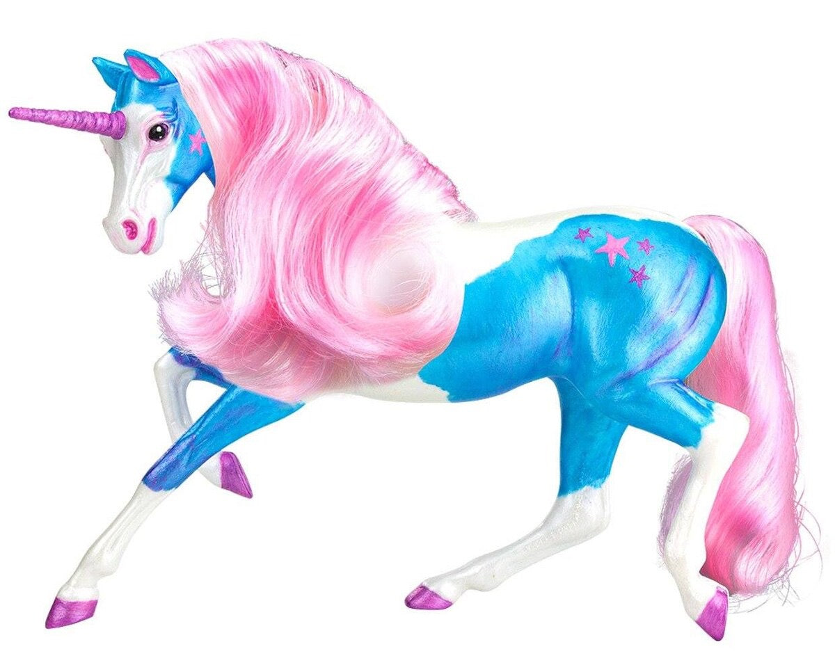 Unicorn model with pink flowing mane and tail.  Painted in blue and white with pink stars on the unicorn's rump.