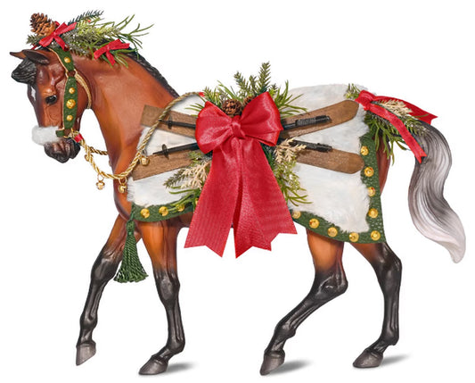 Beautiful model of a bay horse adorned in extravagant Christmas attire.