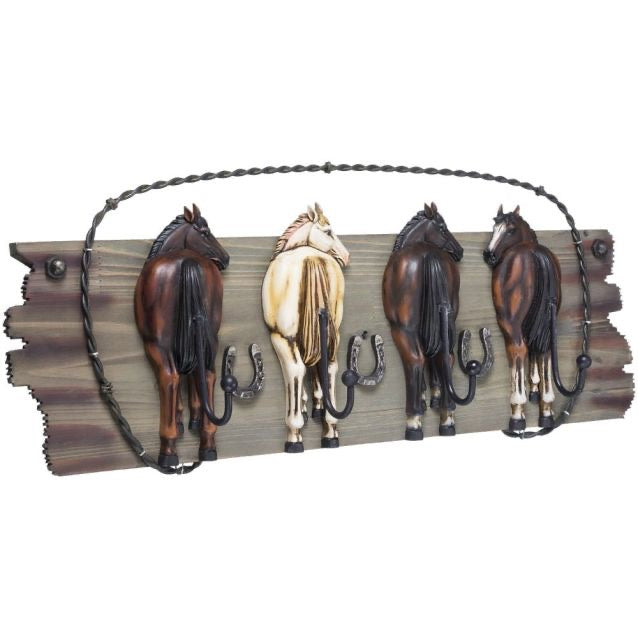 4 hook rack showing 4 horse butts on a wooden base with decorative wire to hang