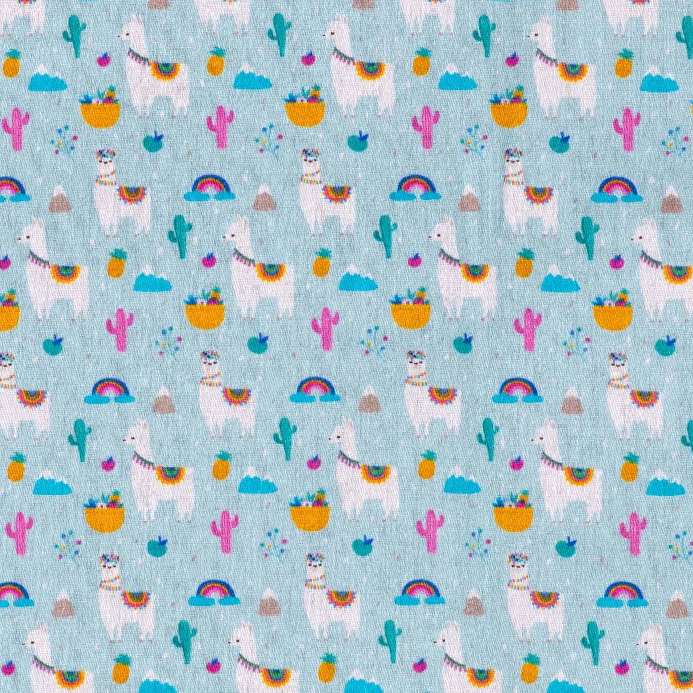 Colorful fabric swatch printed with llamas, cacti and rainbows on a blue background