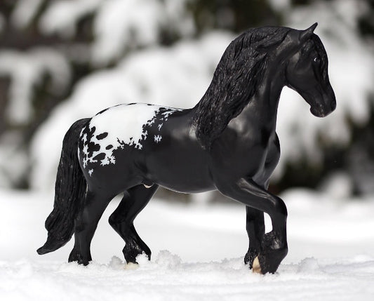 right side view of horse statue in the snow