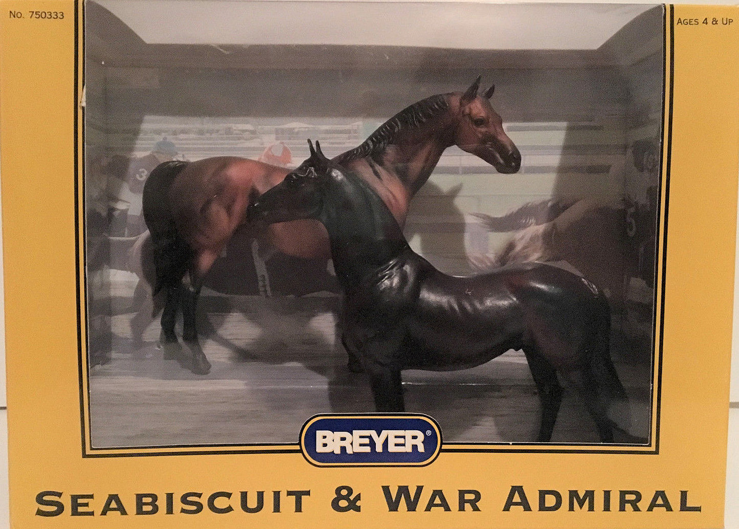 Breyer model horse set in original box packaging, featuring two horses: a dark brown Seabiscuit and a dark gray War Admiral, displayed through a clear window on a yellow box.