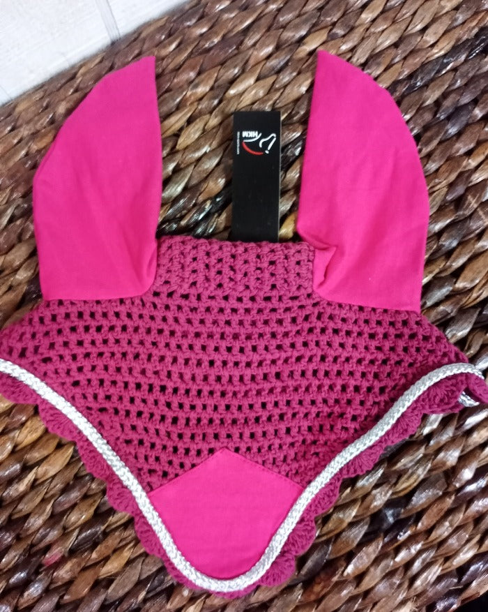 Pink colored crochet fly bonnet for a horse. Silver trim.