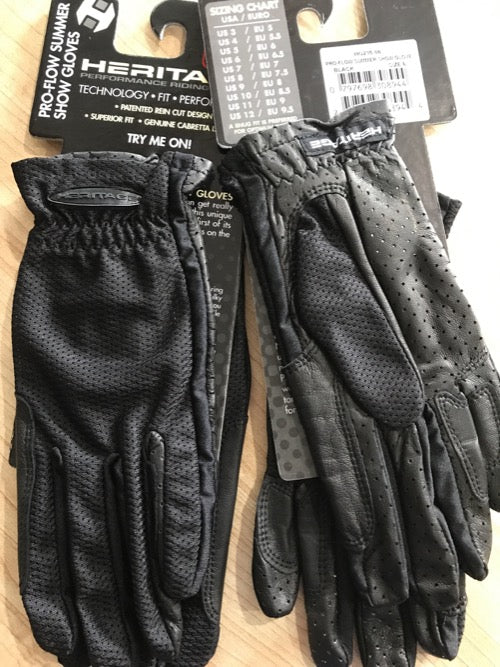 Black equestrian pull on show gloves. Heritage logo on package hanger.