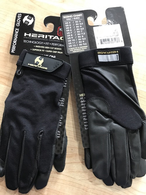 Black equestrian show gloves with velcro wrist. Heritage logo on package hanger and velcro wrist closure.