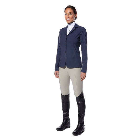 woman model wearing equestrian show cloths - navy jacket, white shirt, tan riding pants and tall riding boots