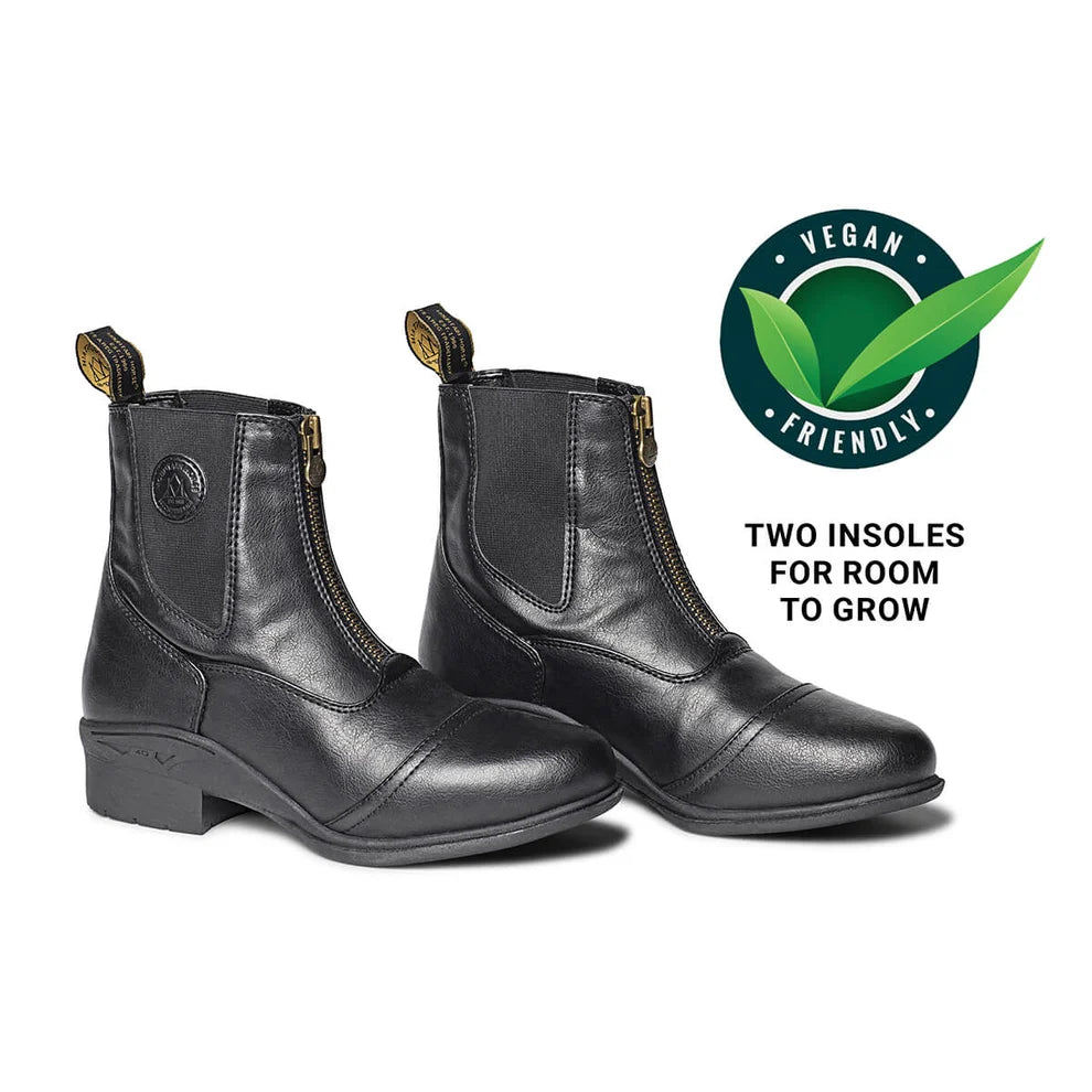 A pair of black paddock boots with front zippers and pull tabs, shown on a white background with a green 'Vegan Friendly' badge and the text 'TWO INSOLES FOR ROOM TO GROW'.