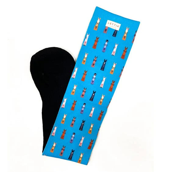 Blue sock with horse heads wearing glasses pattern on a white background