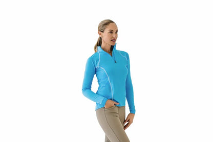 Woman wearing a blue long-sleeve top on a white background