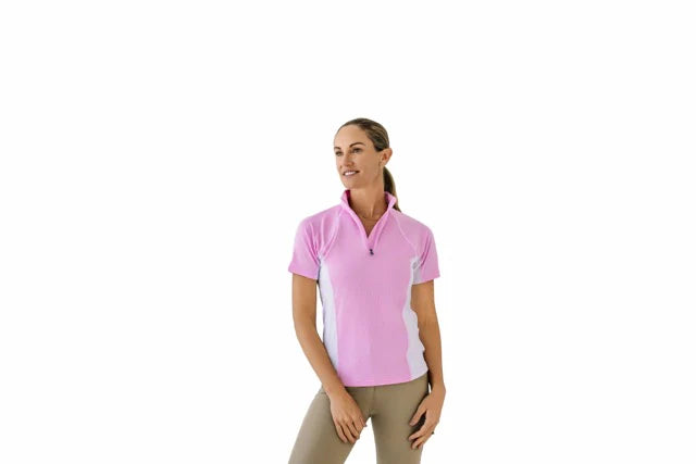 Woman wearing a pink and white quarter zip short sleeve riding shirt on a white background