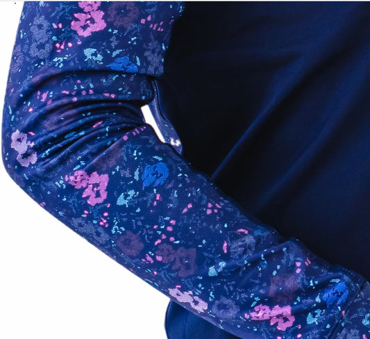 Close-up of a blue floral-patterned fabric with a plain background