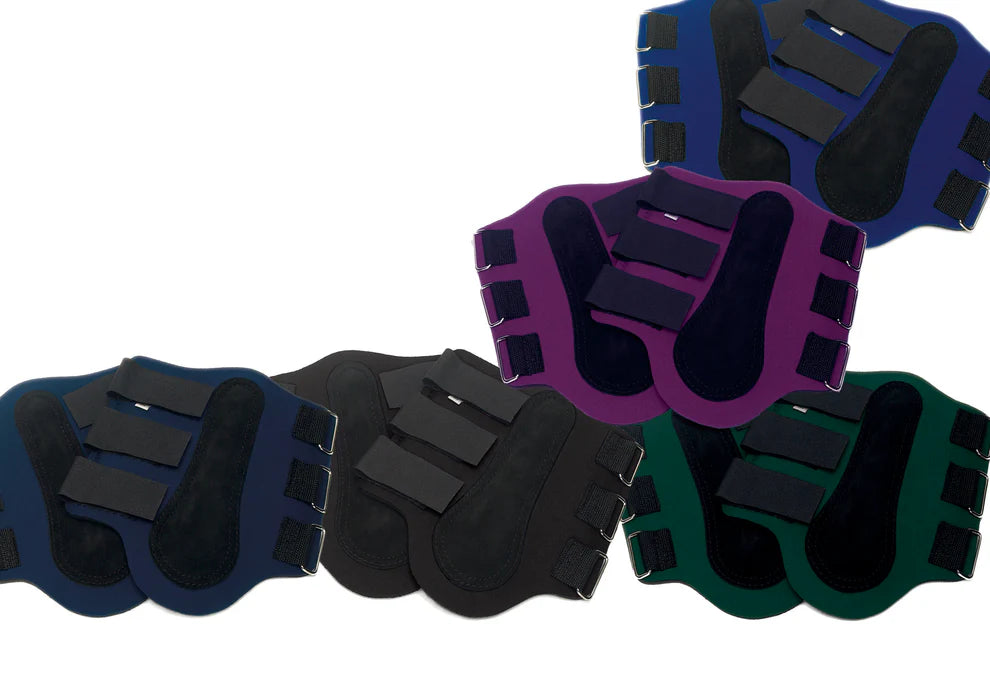 Five different colored pairs of splint boots with velcro closures. 