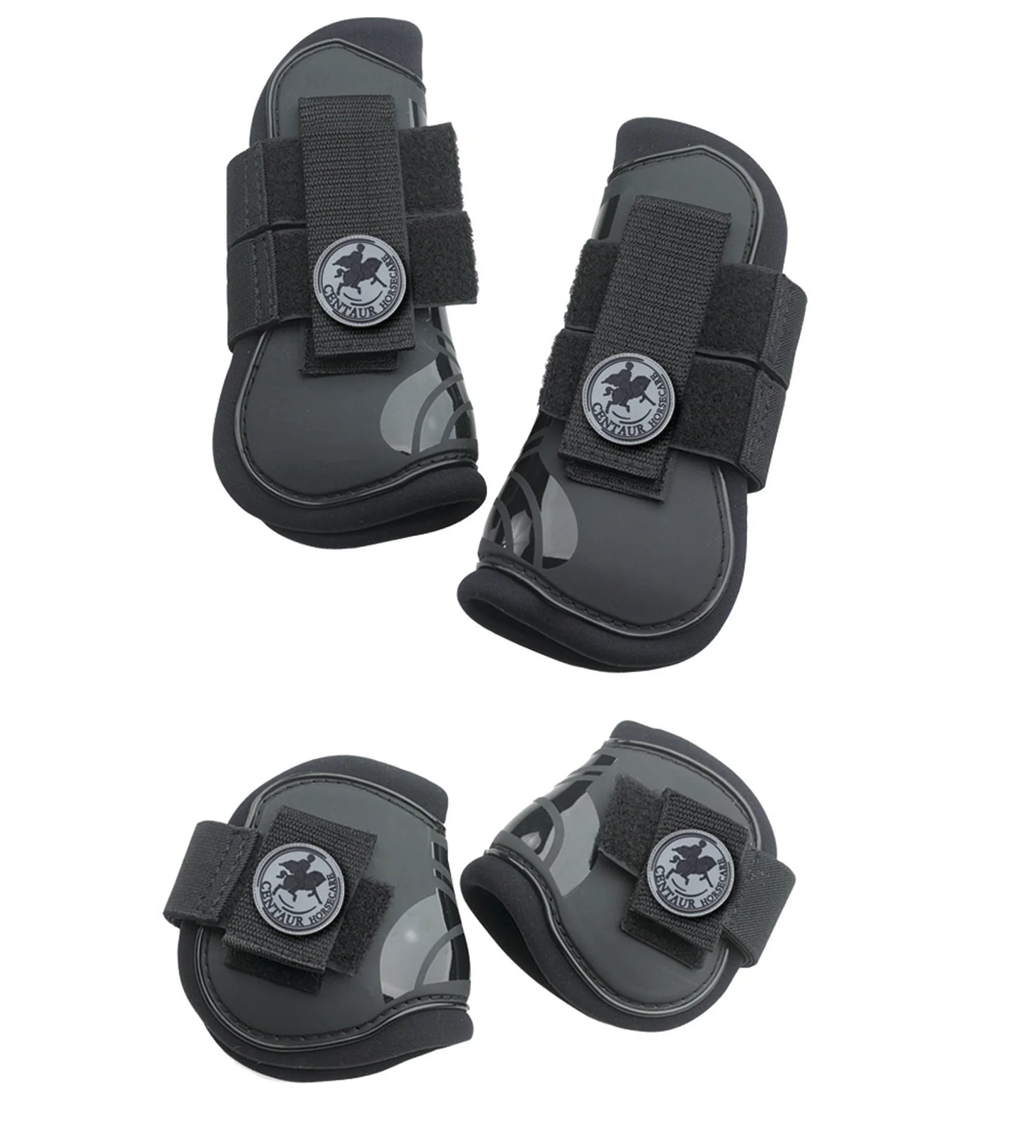 Set of four black protective horse boots with straps on a white background