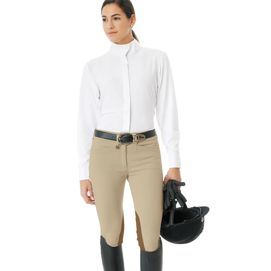Woman in equestrian attire holding a helmet on a white background