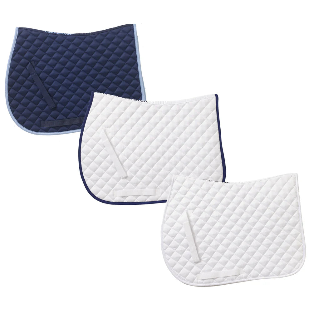 Three quilted saddle pads, one navy, one white with navy trim, and one white, on a white background.