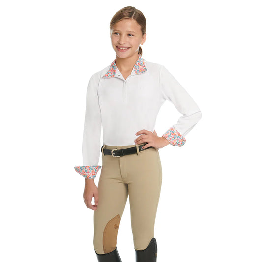 Girl wearing equestrian attire with a white shirt and beige riding pants on a white background