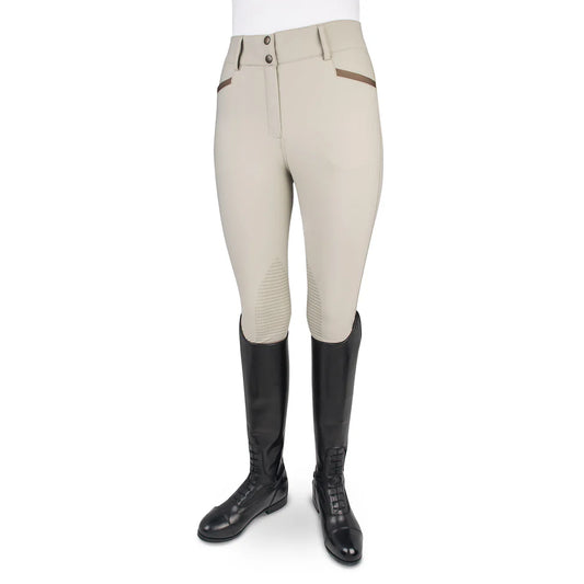 Beige riding pants with black riding boots on a white background