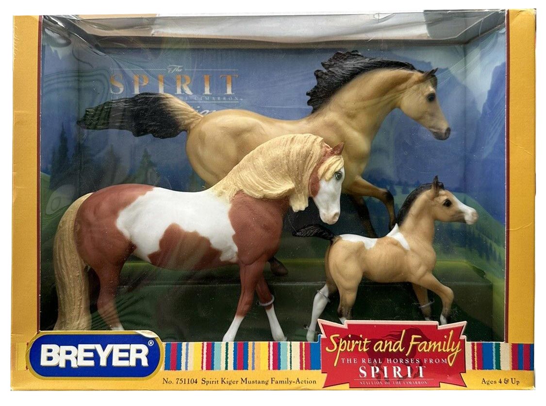 Breyer Spirit and Family 3-in-1 horse action figure set in its original window box packaging, featuring a tan horse, a brown and white pinto horse, and a small tan foal against a scenic backdrop.
