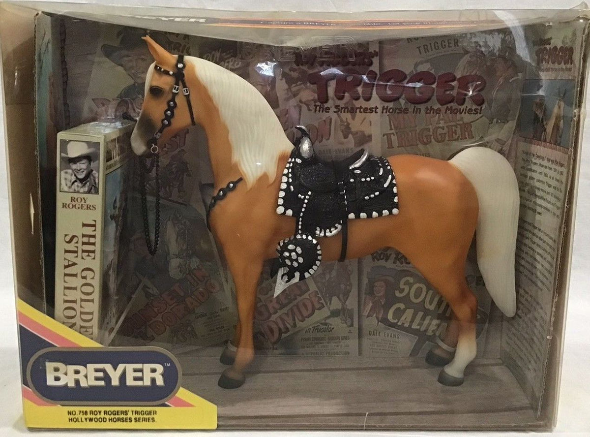 Breyer Trigger horse in its original window box packaging, featuring a palomino horse with western tack.