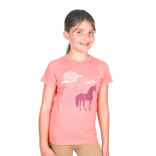 Young girl wearing a pink t-shirt with a horse graphic on a white background