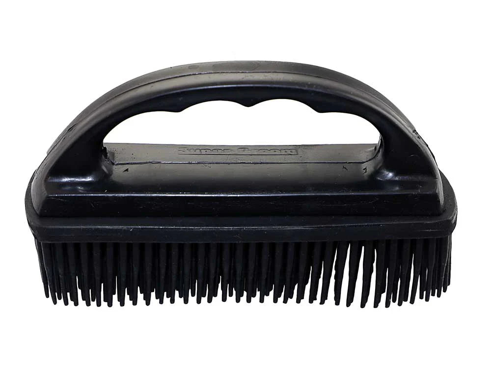 Black rubber grooming brush with a handle on a white background
