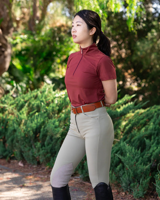 woman modeling tan breeches