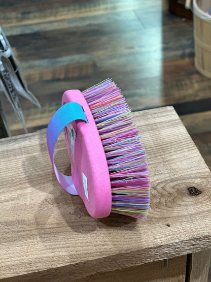 pink hand held grooming brush with medium length, multi colored bristles