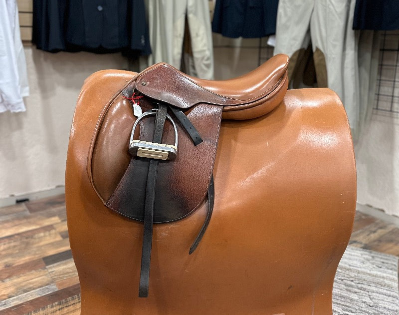 English saddle with two-toned leather and padded knee rolls
