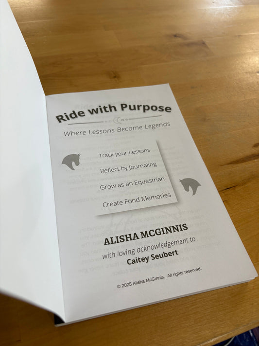 Inside flap of book titled 'Ride with Purpose' on a wooden surface