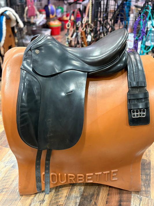 Black leather dressage saddle shown with black leather girth