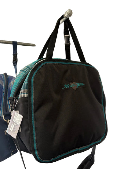 Black Kensington branded luggage with teal plaid accents.