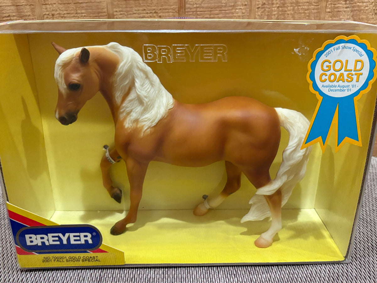 Breyer palomino Horse toy in its original yellow window box packaging, featuring a Gold Coast blue ribbon award badge.