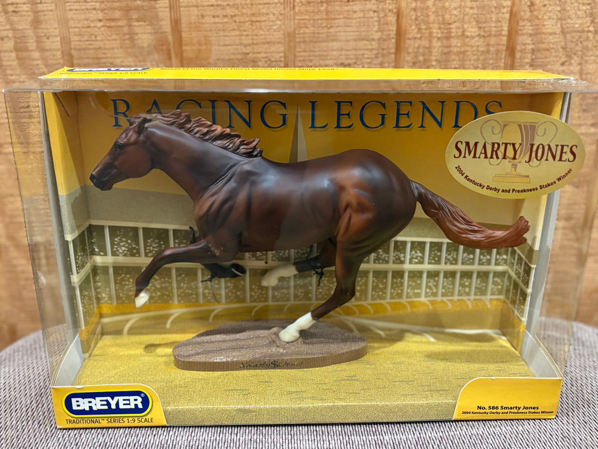 Breyer Racing Legends Smarty Jones 1:9 scale model horse in its original clear plastic display box, featuring a dark brown horse with white socks on a track base.