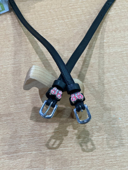 black leather equestrian spur straps with silver buckles. Pink butterflies with silver jewels