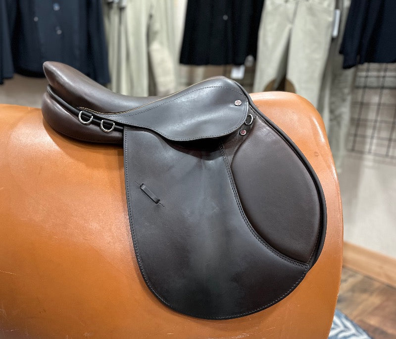 Beautiful brown leather english saddle with knee rolls
