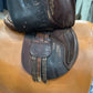 view of under right side of English riding saddle sitting on saddle model 