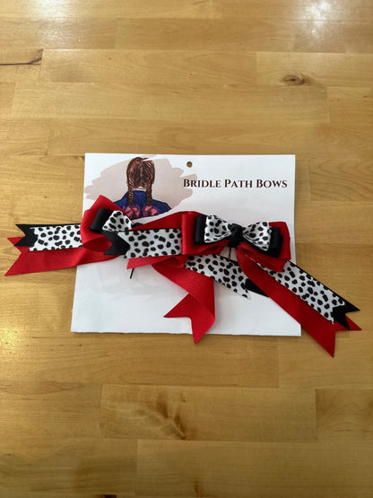 Image of children’s horse riding show bows, red black and white with black polka dots