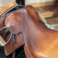 top view of a light brown colored english saddle.  Photo shows a stretched leather seat with no stitching at the pommel.